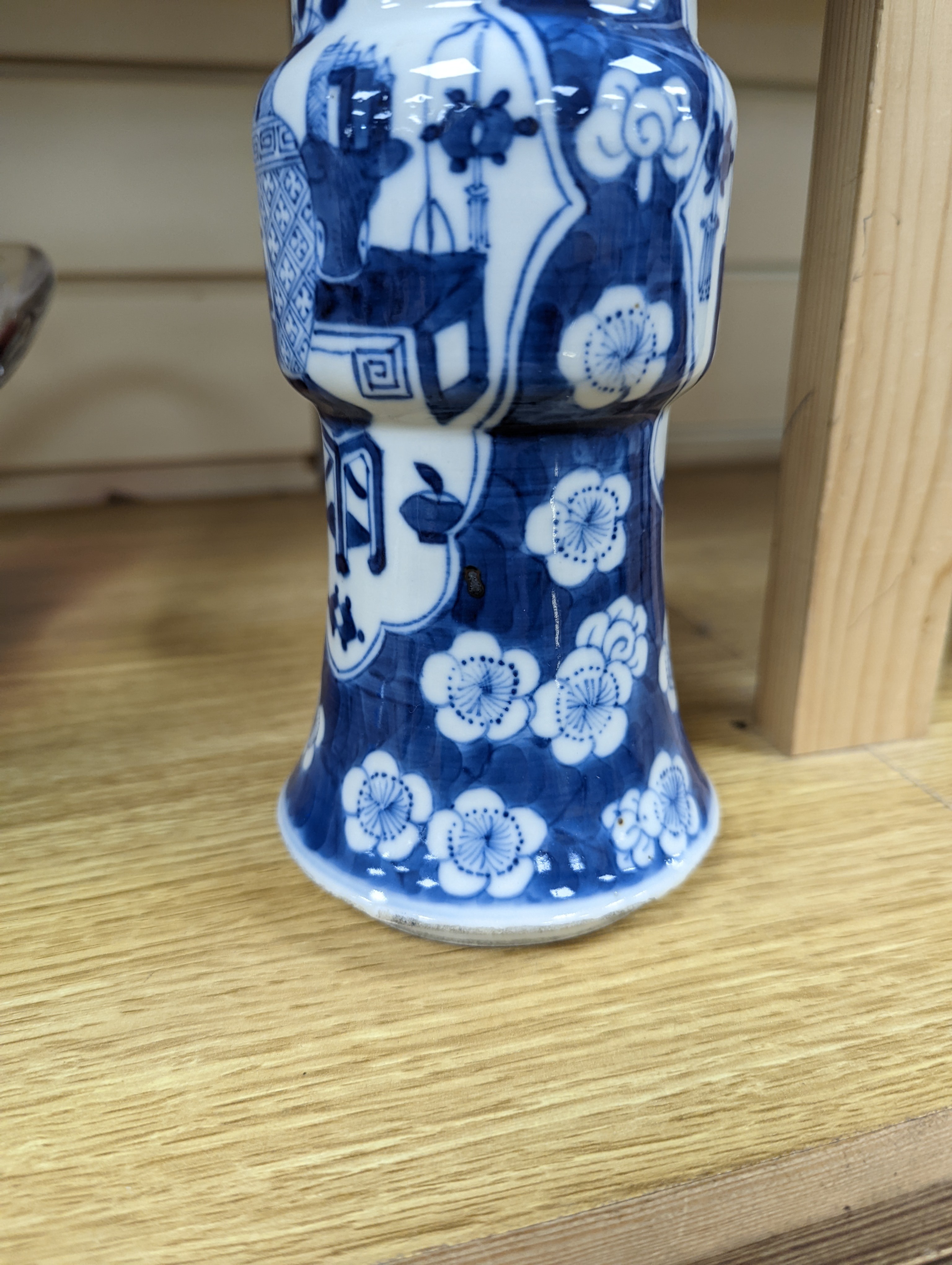 A 19th century Chinese blue and white prunus gu vase, 25 cms high.